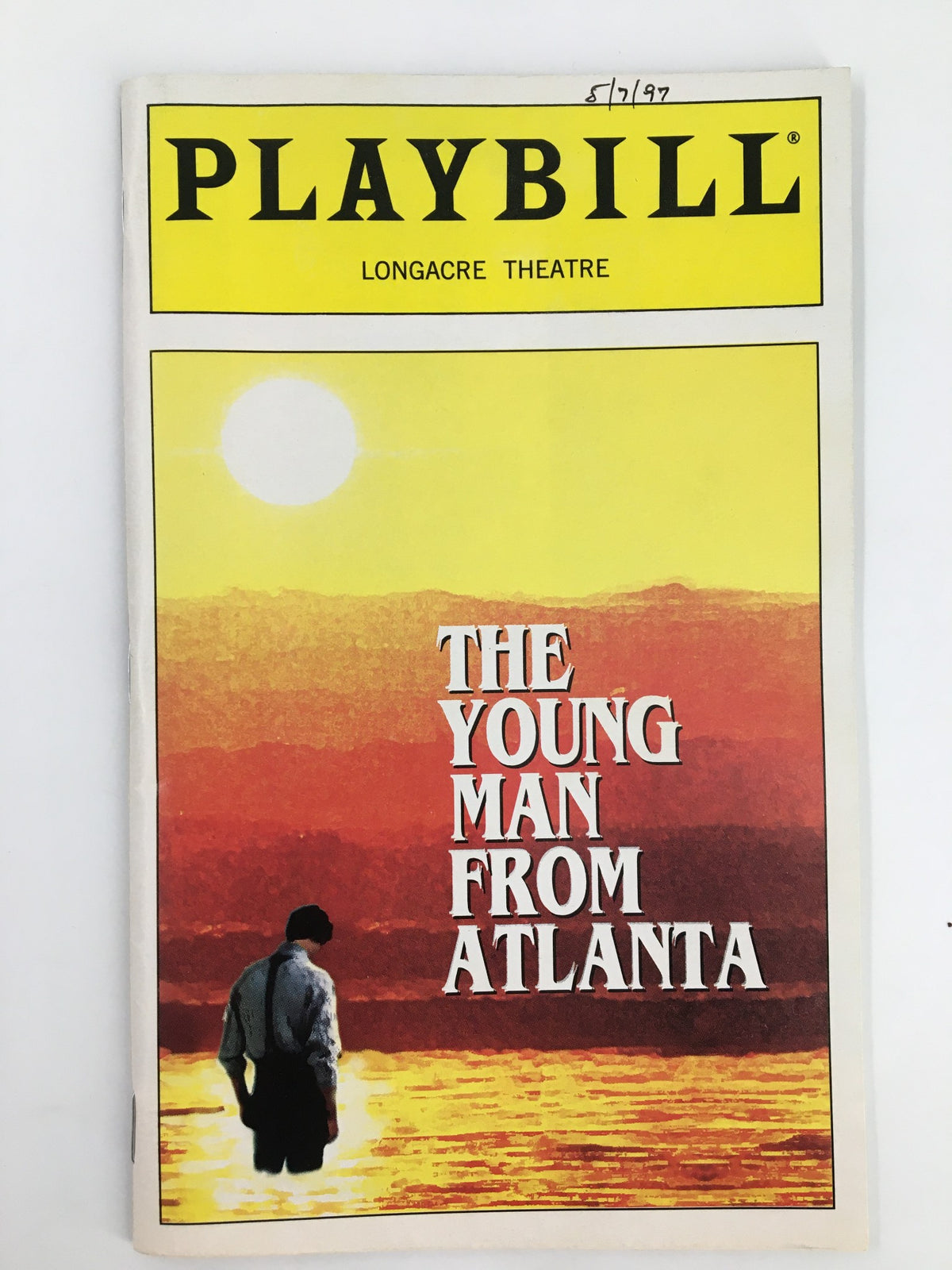 1997 Playbill from the Longacre Theatre featuring the title 'The Young Man From Atlanta' with a scenic sunset background and silhouette of a man, highlighting the theatrical performance starring Rip Torn.