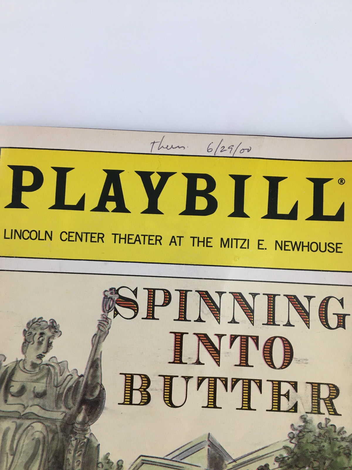 2000 Playbill Lincoln Center Theater with focus on the title Spinning Into Butter and handwritten date from June 29, 2000.