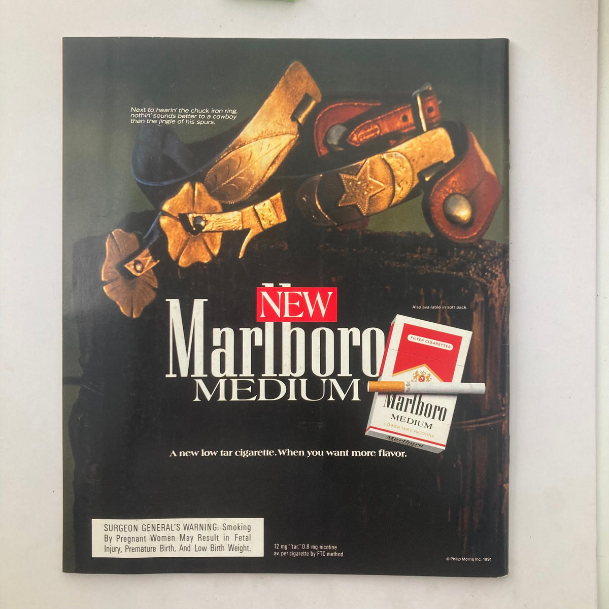 Cover page of a cigarette advertisement featuring 'NEW Marlboro MEDIUM', featuring cowboy boots and spurs, highlighting the product alongside a health warning, related to the TV Guide Magazine 1991 issue with Lucy Ball's commemorative edition.