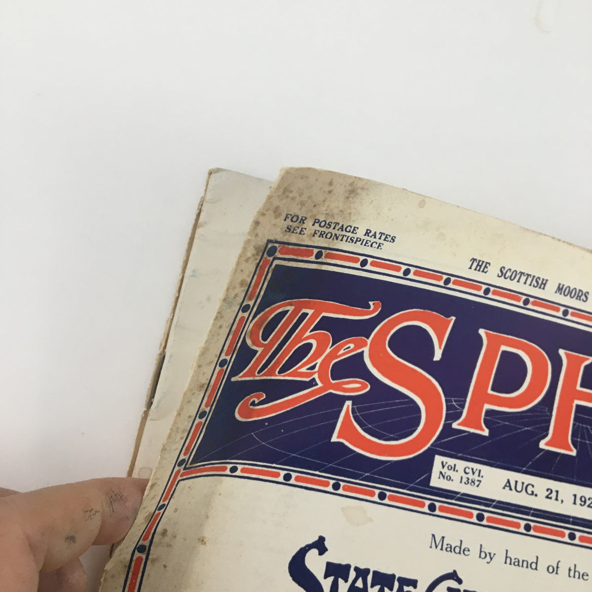 Detailed view of The Sphere Newspaper from August 21, 1926, focusing on the cover edge with minor wear, emphasizing its age and historical context.