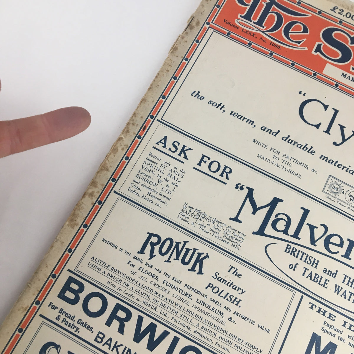 Detail of The Sphere Newspaper March 6 1920 featuring advertisements, with a finger pointing to the section on Malvern, reflecting the typical layout of 1920s publications.