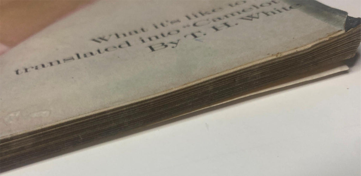 Close-up image of the spine of Vogue Magazine February 15, 1961, illustrating its vintage condition and wear, relevant to collectors of classic fashion magazines.