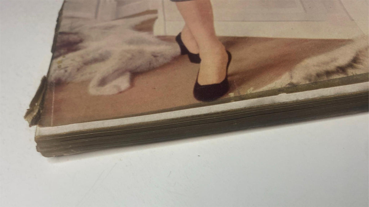 Image detailing the spine of Vogue Magazine September 1, 1955 Renée Breton Cover by Henry Clarke, illustrating the magazine's vintage condition and structure.