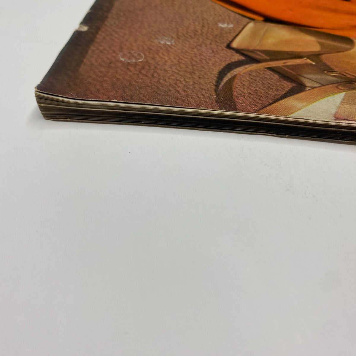 Side view of the spine of Vogue Magazine October 15, 1950, showing its vintage characteristics and binding details. The issue highlights fashion and lifestyle trends from postwar America.