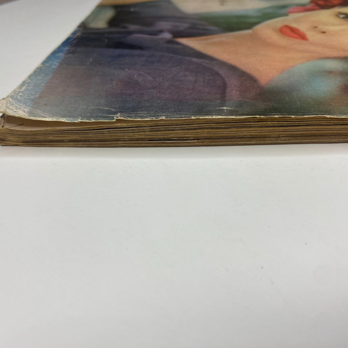 Side view of the Vogue Magazine March 1, 1960 featuring Sondra Peterson on the cover, showcasing its vintage paper condition and spine.