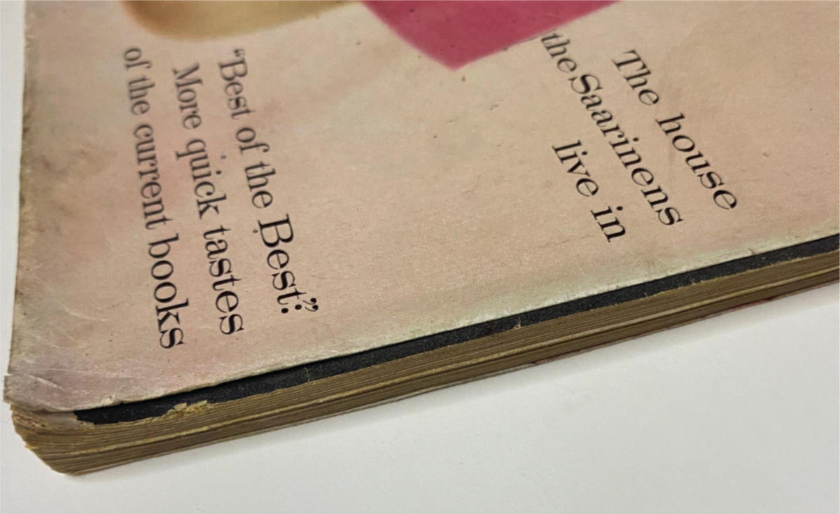 Bottom edge of Vogue Magazine April 1, 1960, showing wear and a partially torn cover, depicting the magazine's age and authenticity.