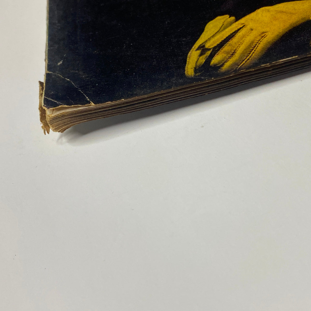 Close-up of the spine of Vogue Magazine January 1, 1944 Marilyn Ambrose Cover by John Rawlings, highlighting the vintage binding details.