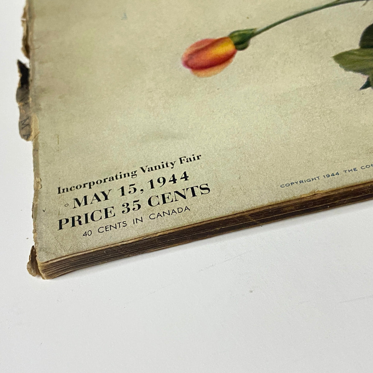Bottom corner of Vogue Magazine May 15, 1944 indicating price details, highlighting historical pricing as part of the magazine's vintage charm.
