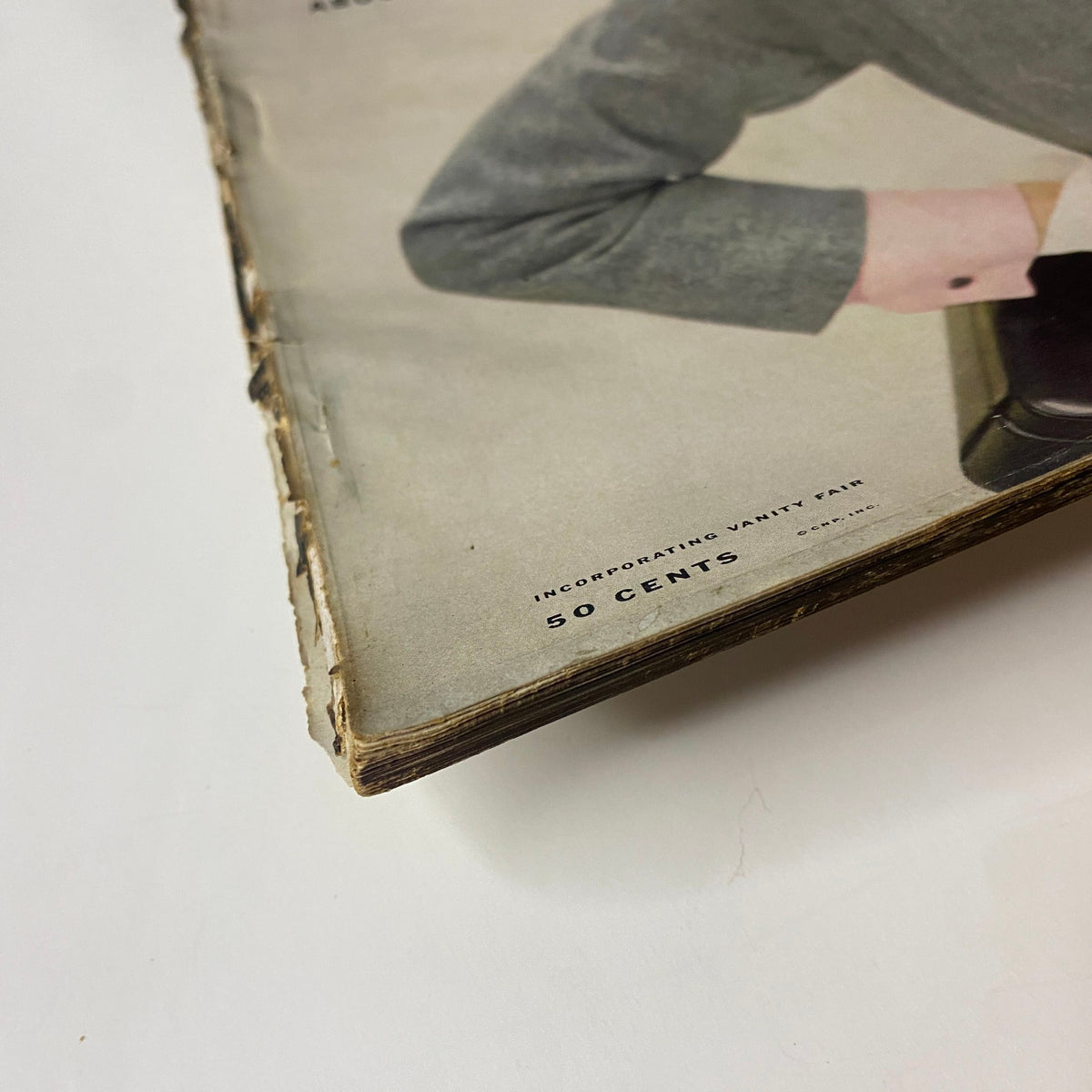 Vogue Magazine February 15, 1952 featuring Janet Randy, focusing on the magazine's worn cover edge, indicative of its vintage condition.