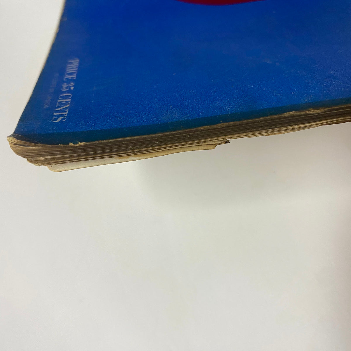 Side profile of Vogue Magazine, February 1, 1942, displaying the aged edges and characteristic wear of a vintage publication. This issue focuses on women's roles and morale during wartime.