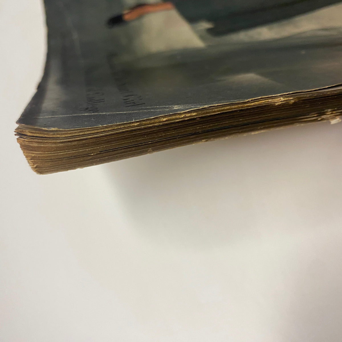 Vogue Magazine August 15, 1947 Joan Petit by Frances McLaughlin-Gill depicting the edge of the magazine, showcasing its aged pages and binding, indicative of its historical value and vintage characteristics.