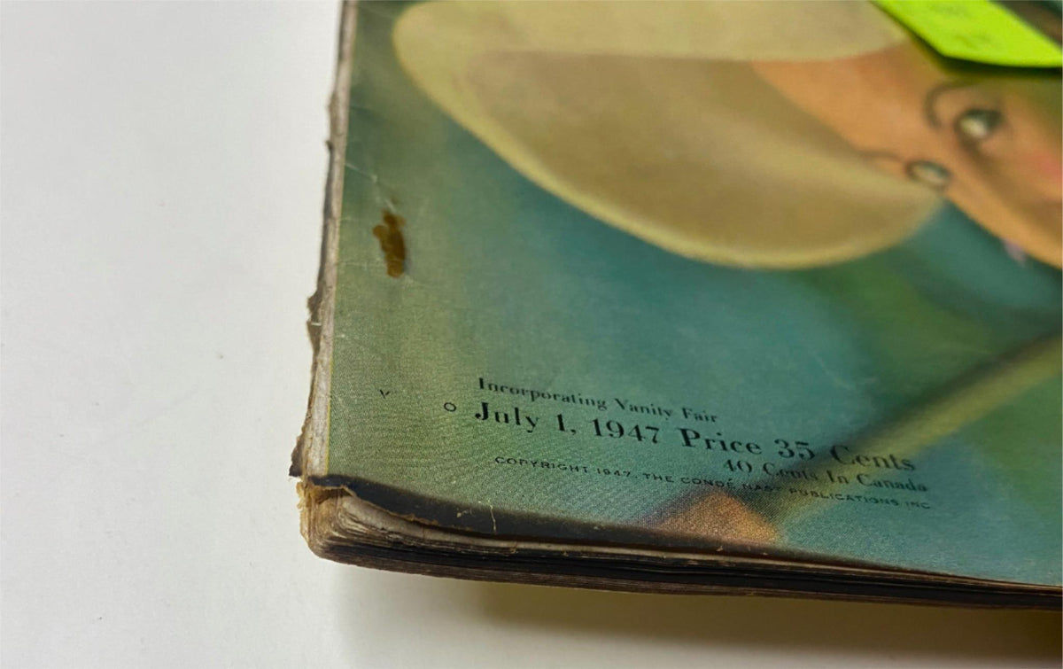 Close-up of the spine of Vogue Magazine July 1, 1947 titled 'Joan Pedersen Cover by Richard Rutledge', highlighting wear with a price tag indicating 35 cents and noting its vintage condition.