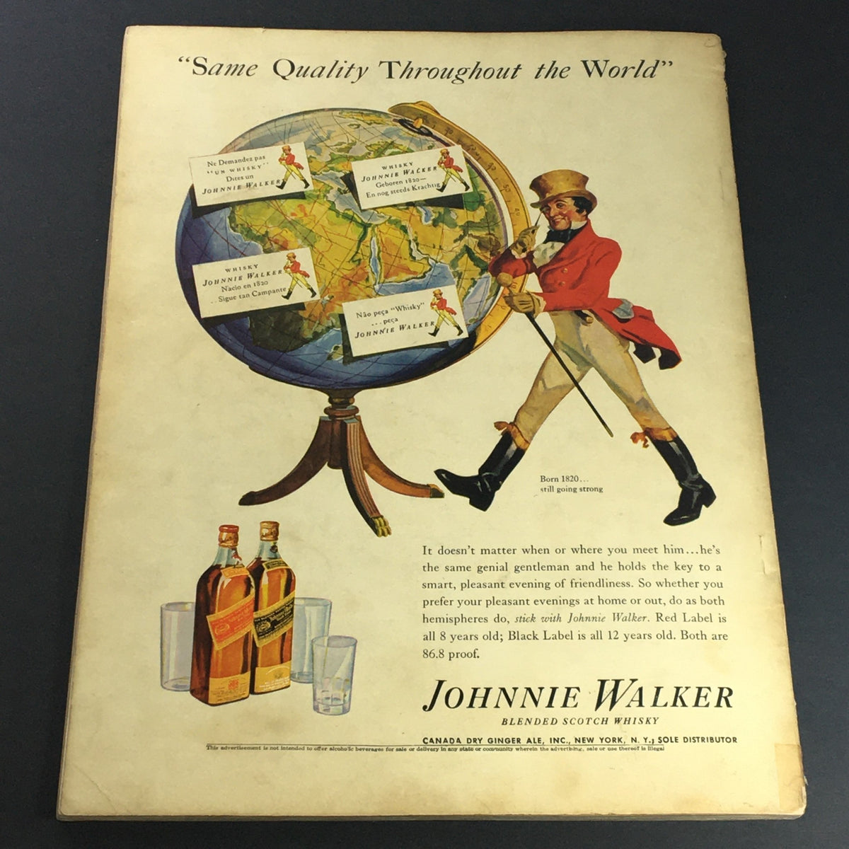 Advert for Johnnie Walker whisky in the VTG Illustrated Football Annual Magazine 1938, showcasing a classic illustration of a gentleman with a globe.
