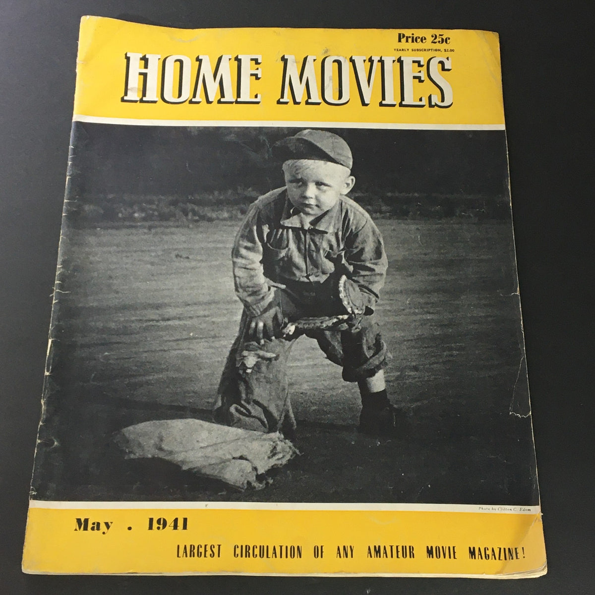 Cover of VTG Home Movies Magazine May 1941, featuring a young boy on the front cover, illustrative of the magazine's focus on home filmmaking.
