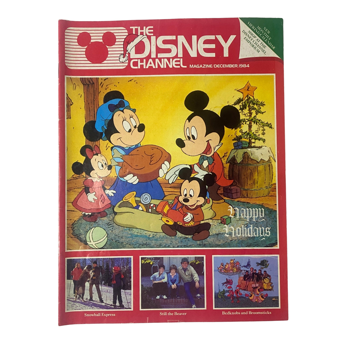 Cover of The Disney Channel Magazine December 1984 featuring Mickey's Christmas Carol, with Mickey and friends celebrating the holidays.