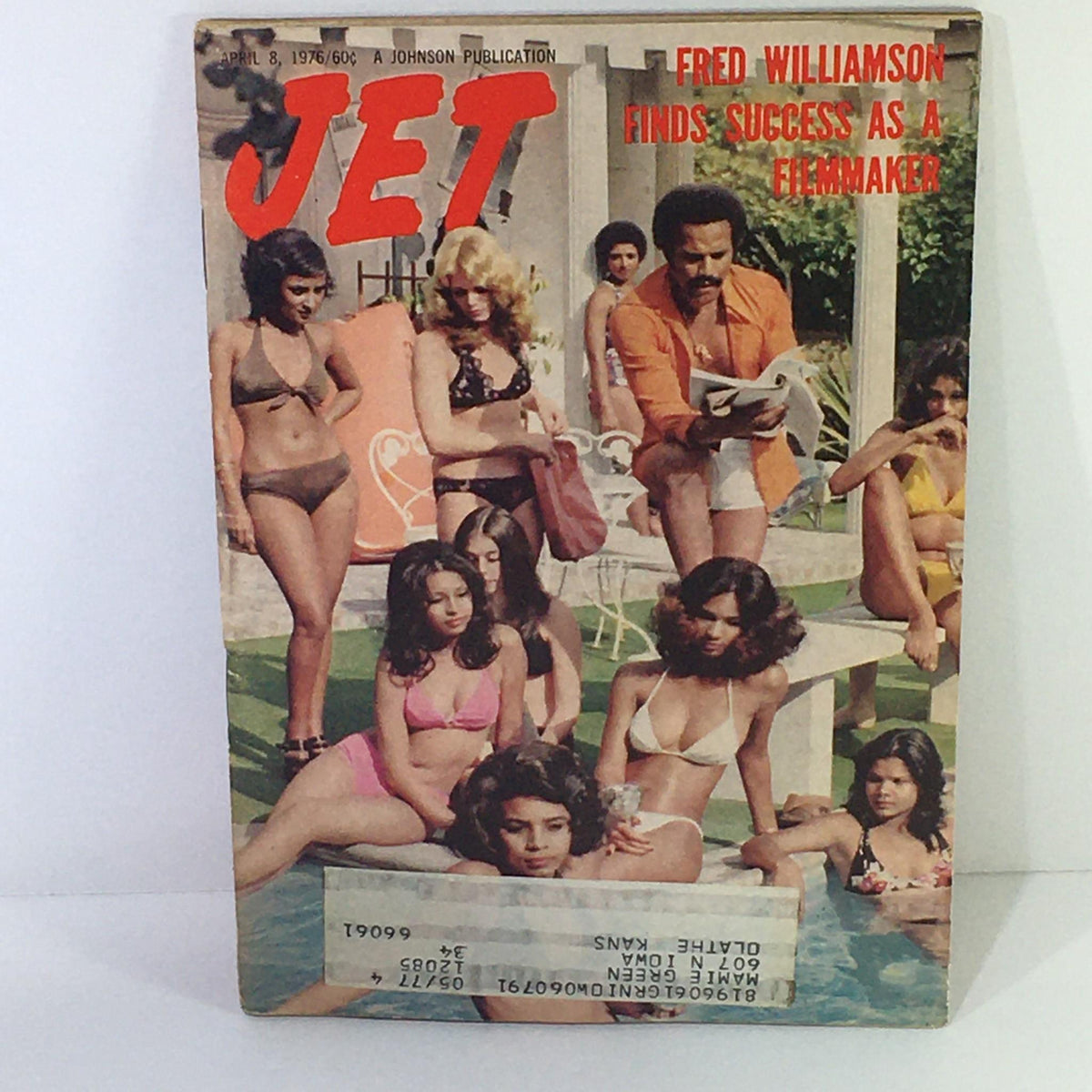 Cover of Jet Magazine from April 8, 1976, featuring Fred Williamson finds success as a filmmaker, depicting a vibrant pool scene with several women in swimsuits.