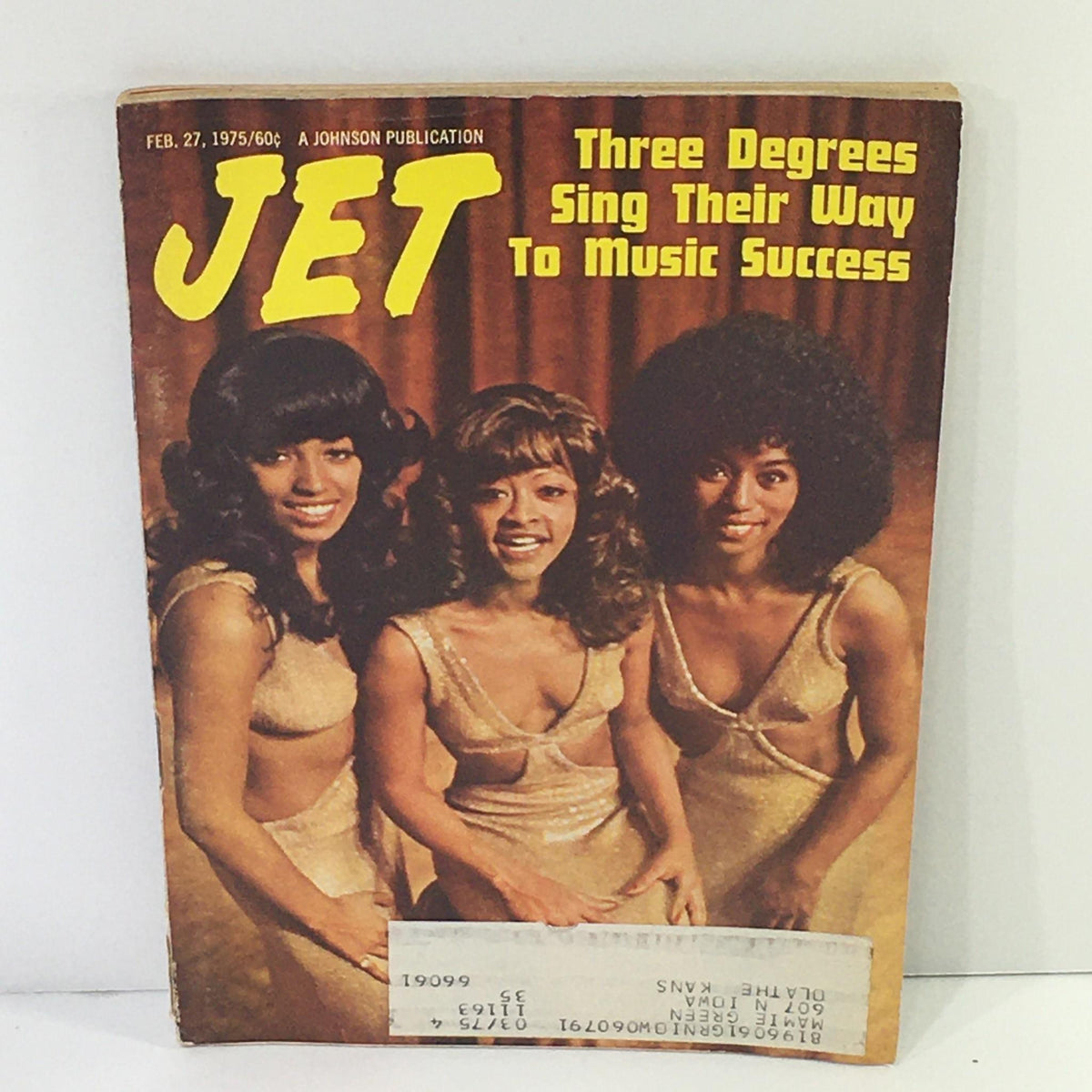 Cover image of Jet Magazine dated February 27, 1975 featuring the article 'Three Degrees Sing Their Way To Music Success'. The magazine showcases three women in golden dresses against a warm-toned backdrop, highlighting the prominent musical trio of the 1970s known for their soulful performances.