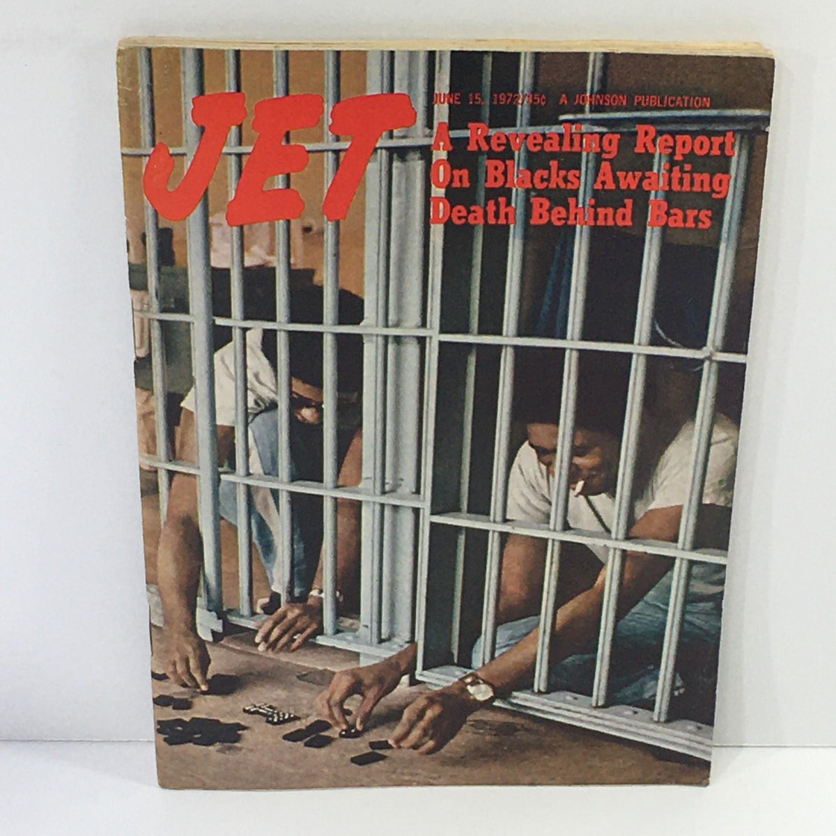 Cover of Jet Magazine from June 15, 1972. Highlights a revealing report on Blacks awaiting death behind bars, featuring two individuals reaching through prison bars while playing a game on the floor.