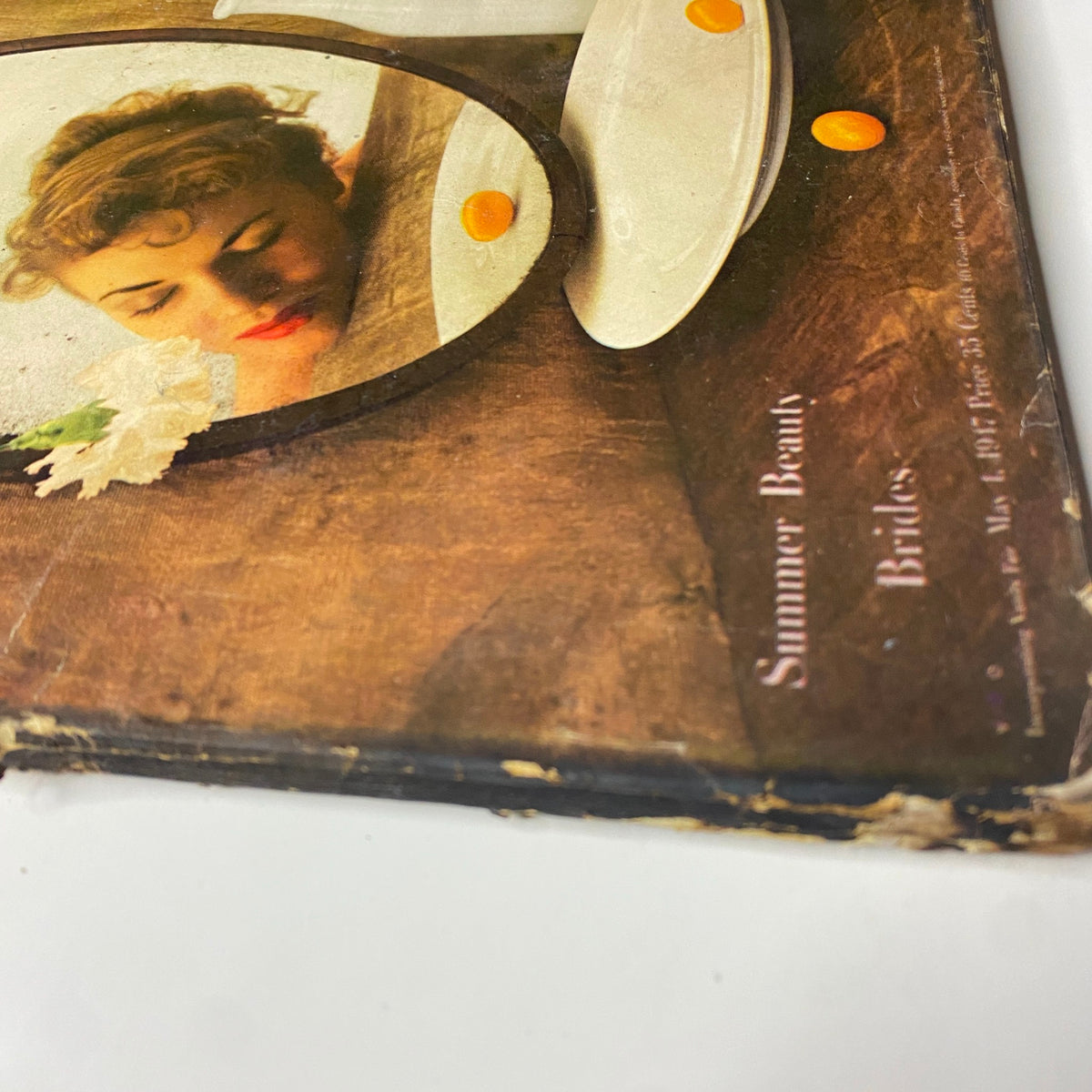 Detailed view of the cover of Vogue Magazine May 1, 1947 Summer Beauty Brides by Irving Penn, featuring the title and floral elements.