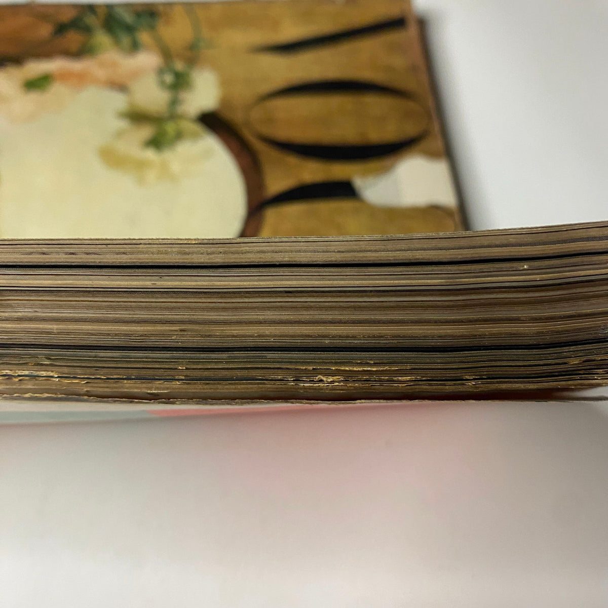 Detailed view of the magazine's edge, displaying the aged paper and vintage characteristics of Vogue Magazine May 1, 1947 Summer Beauty Brides by Irving Penn.
