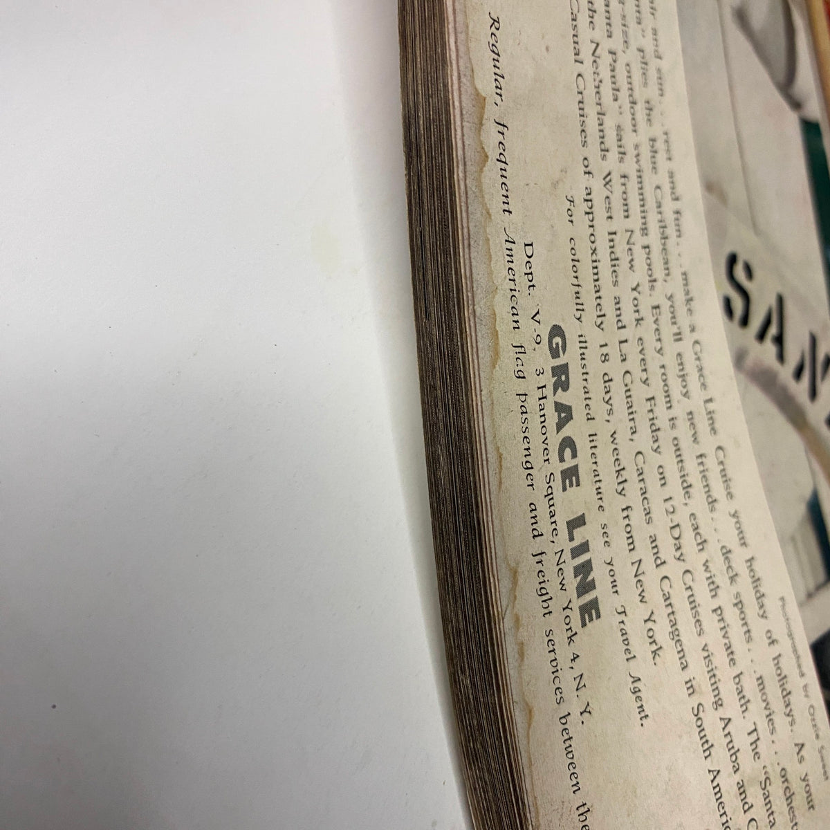 Close-up view showing the spine of Vogue Magazine, September 15, 1957, featuring Mary Jane Russell on the cover by John Rawlings. The image highlights the vintage wear and texture typical of mid-century publications.
