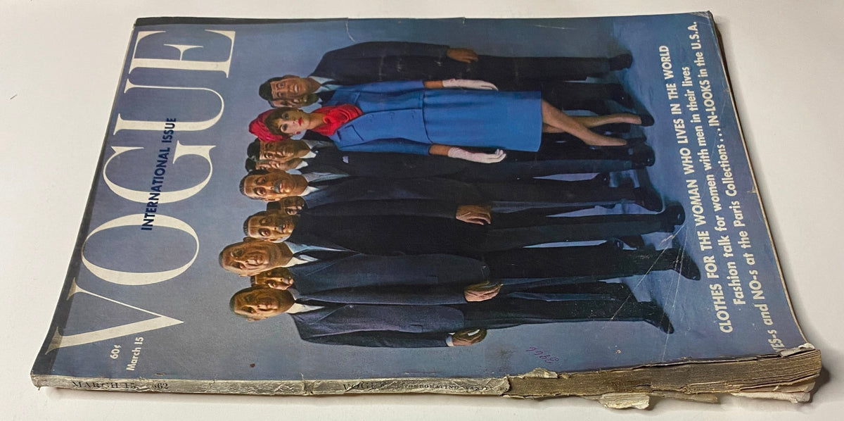 Cover of Vogue Magazine from March 15, 1962 featuring the title 'Vogue' prominently displayed, showcasing Gillis McGil photographed by Art Kane, surrounded by diverse models in an elegant setting.