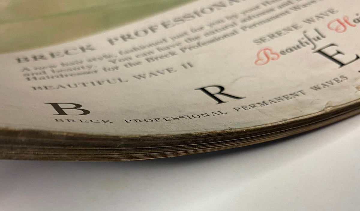 Detail shot of the edges of Vogue Magazine March 15, 1962, showcasing the magazine's title and vintage wear, reflecting its historical value.