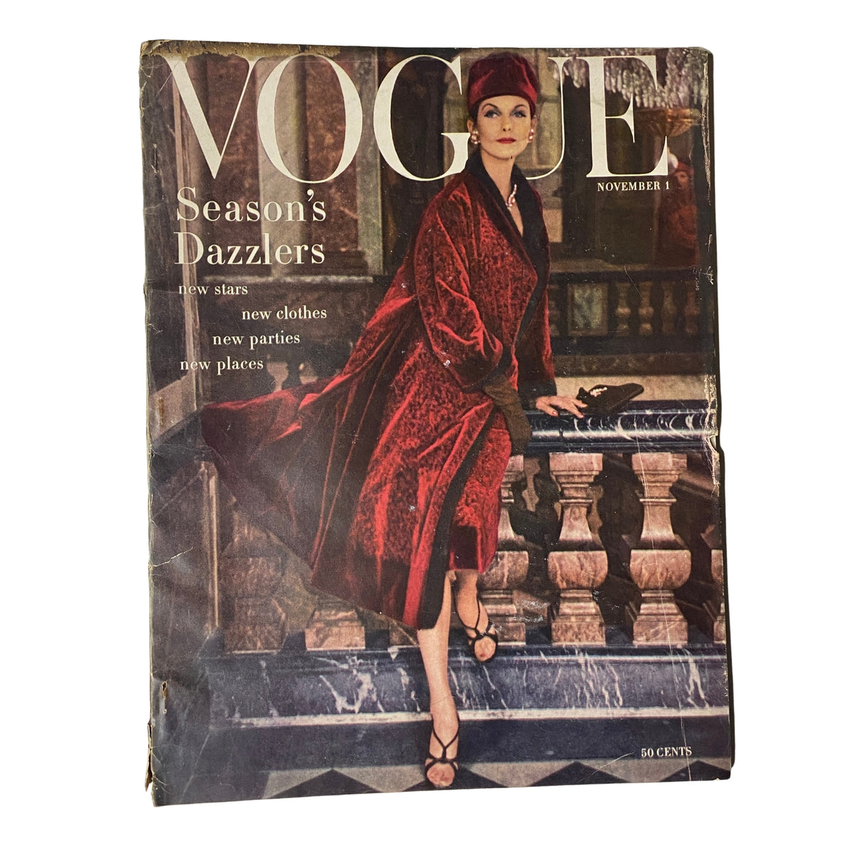Vintage Vogue Magazine cover for November 1, 1955 featuring Anne St. Marie in a red garment, exemplifying the season's fashion trends.