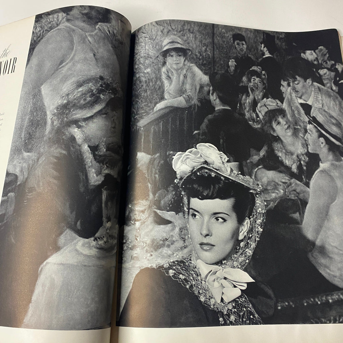 A striking black and white image from Vogue Magazine January 15, 1942 featuring a stylish model adorned with a lace headpiece, surrounded by a scene of women exemplifying the cultural elegance during wartime under the theme 'New Design for Our Double-Duty Lives.'