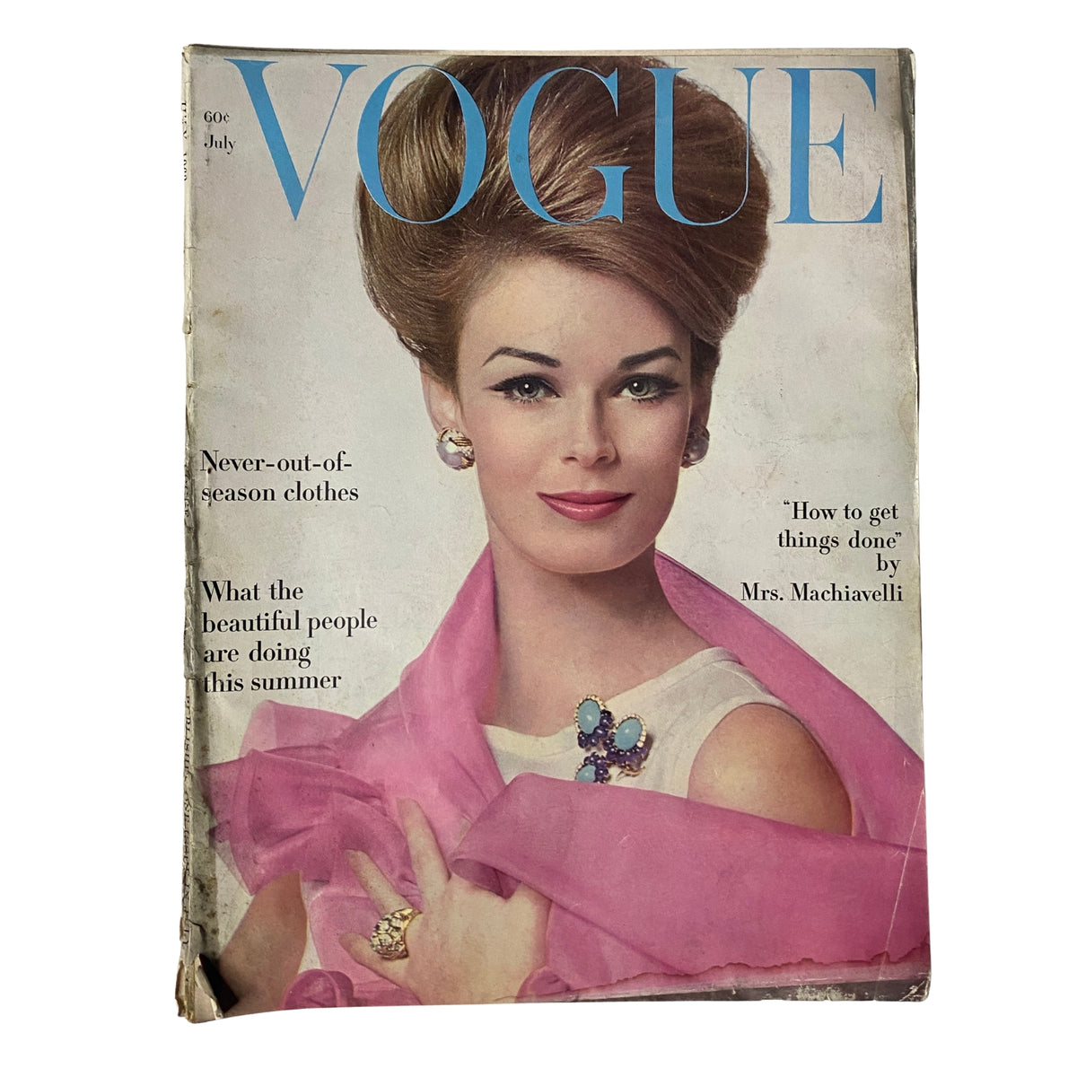 Vogue Magazine July 1962 featuring Anne De Zogheb on the cover, photographed by Bert Stern, showcasing vintage fashion with a striking hairstyle and elegant jewelry.