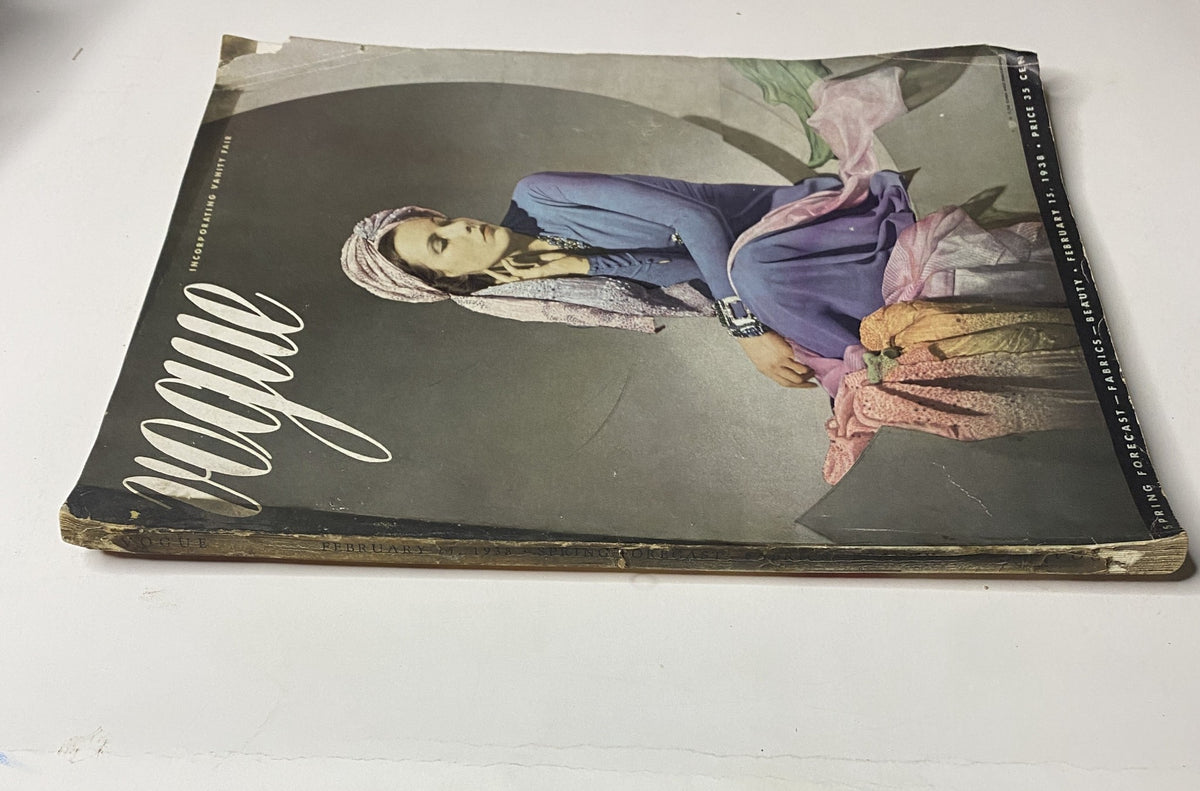 Side view of Vogue Magazine February 15, 1938 with Angelica Welldon on the cover, emphasizing the vintage design and color palette.