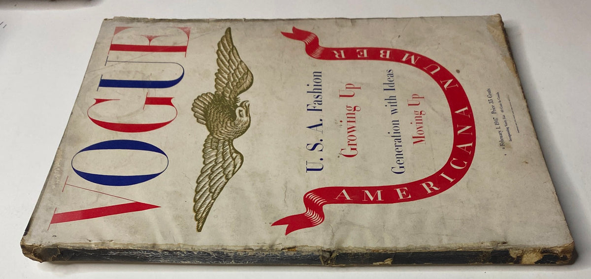 Side view of Vogue Magazine from February 1, 1947, titled 'U.S.A. Fashion Growing Up'. Displays the iconic eagle logo and emphasizes its Americana theme.