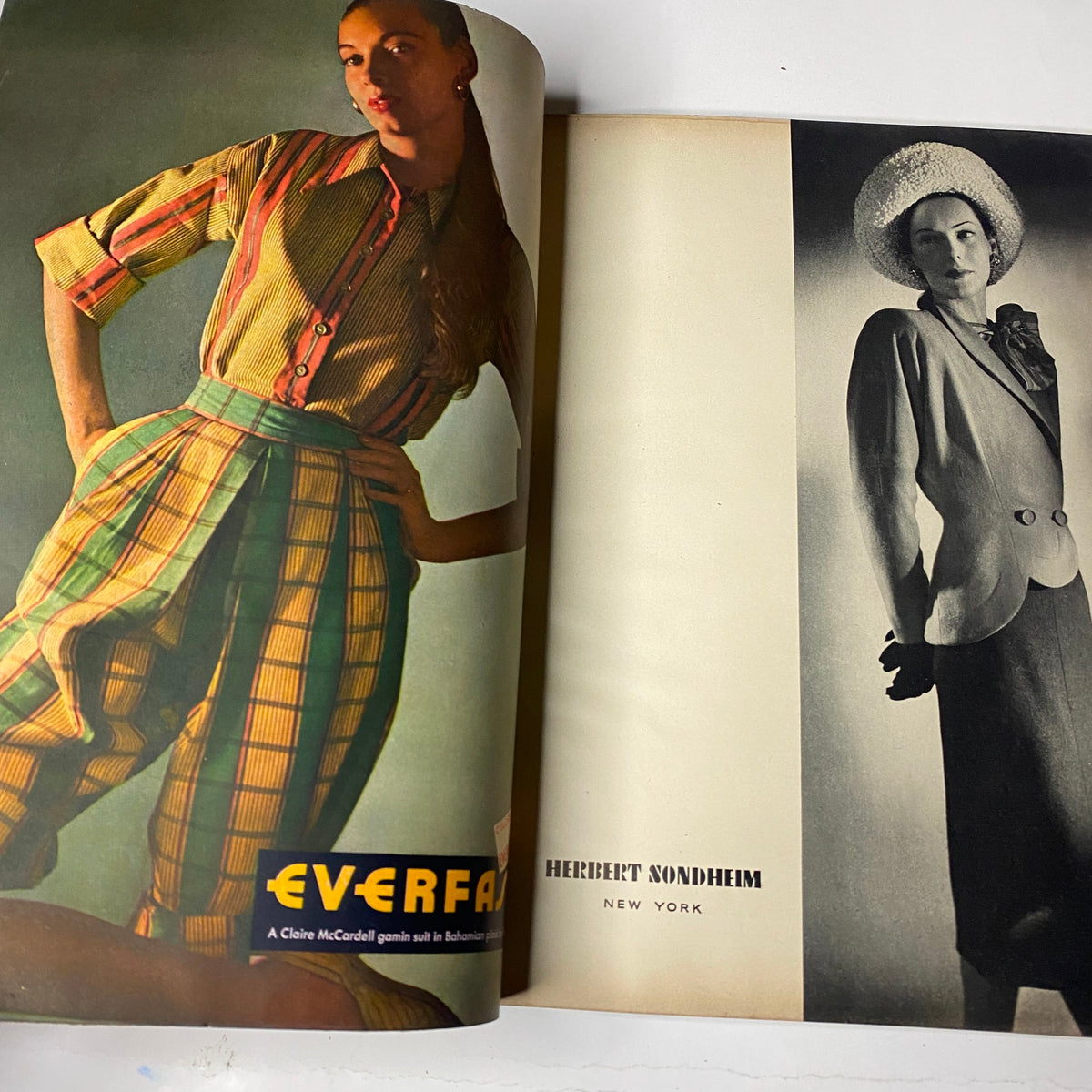 Vogue Magazine February 1, 1947 showcasing colorful 1940s fashion designs, featuring plaid trousers and a chic blazer with a fashionable hat.