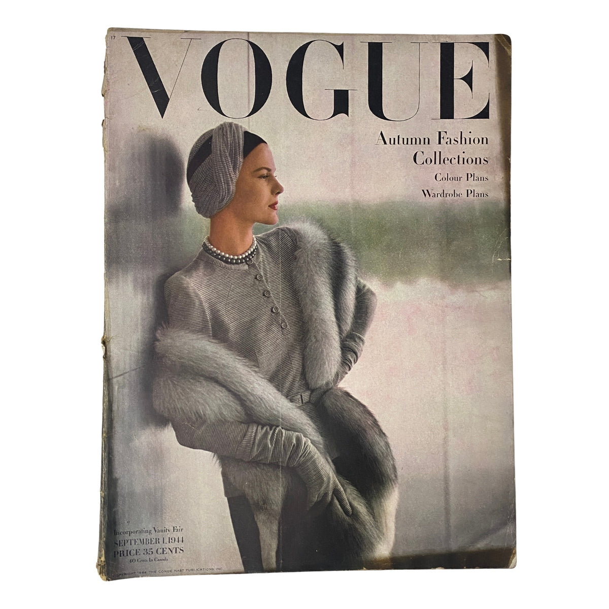 Vogue Magazine September 1, 1944 Selene Mahri Cover by John Rawlings featuring a model in autumn fashion with a fur stole and elegant attire, showcasing the essence of mid-century style and post-war elegance.