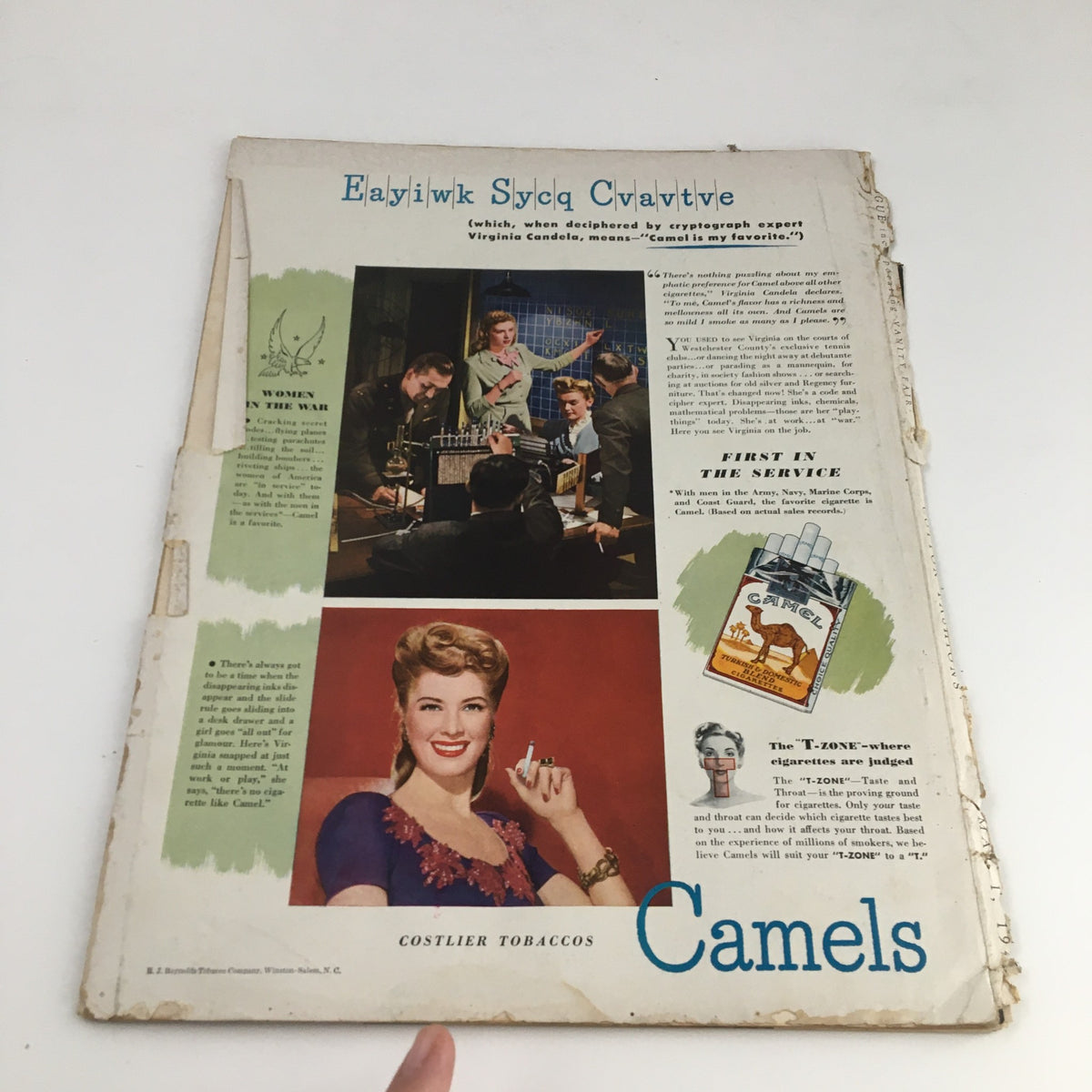 Back cover of the VTG Vogue Magazine May 1 1944, featuring an advertisement for Camels cigarettes with a professional woman and military personnel.