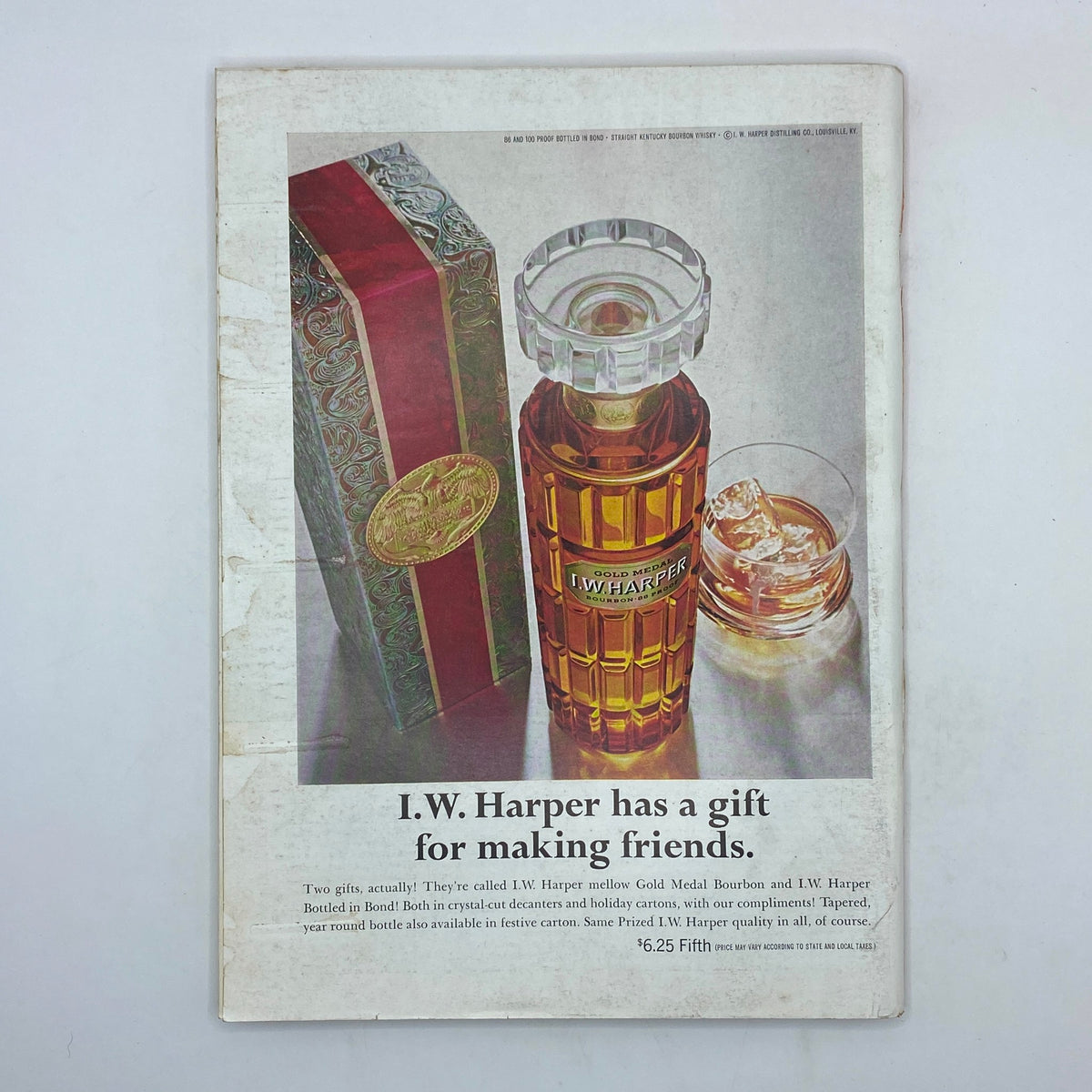 An advertisement featured in The New Yorker magazine, showcasing I.W. Harper bourbon with an elegant bottle design and holiday gift packaging.