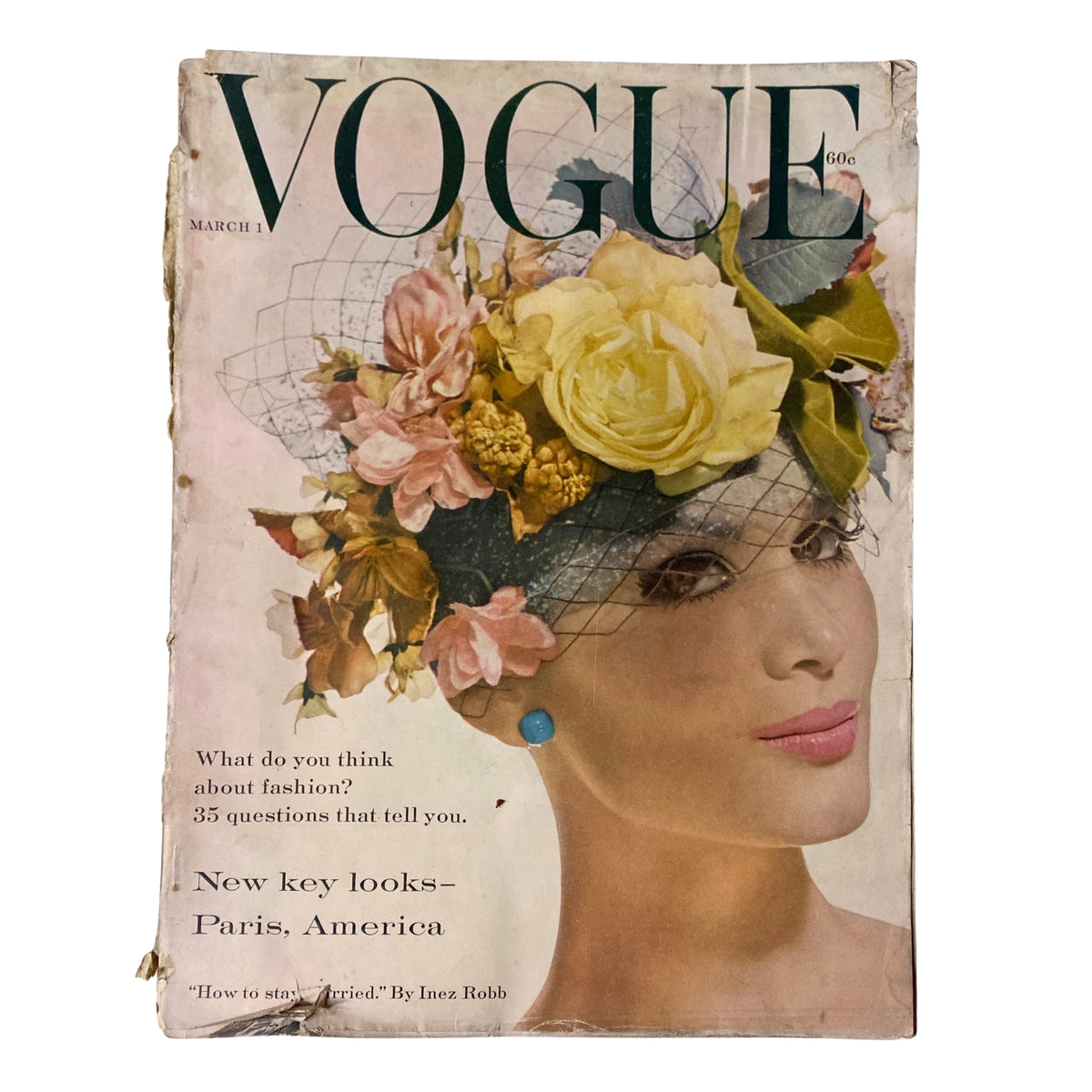 Vogue Magazine March 1, 1959 cover featuring Isabella Albonico by Irving Penn, showcasing floral headpiece, vintage fashion, and editorial text questions about fashion.
