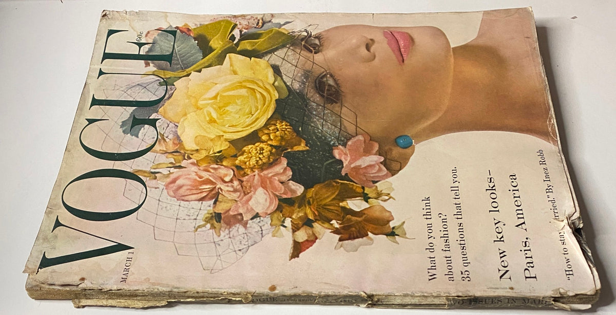 Vogue Magazine March 1, 1959 cover with a close-up of a model wearing a floral headdress, promoting new fashion looks in Paris and America, photographed by Irving Penn.