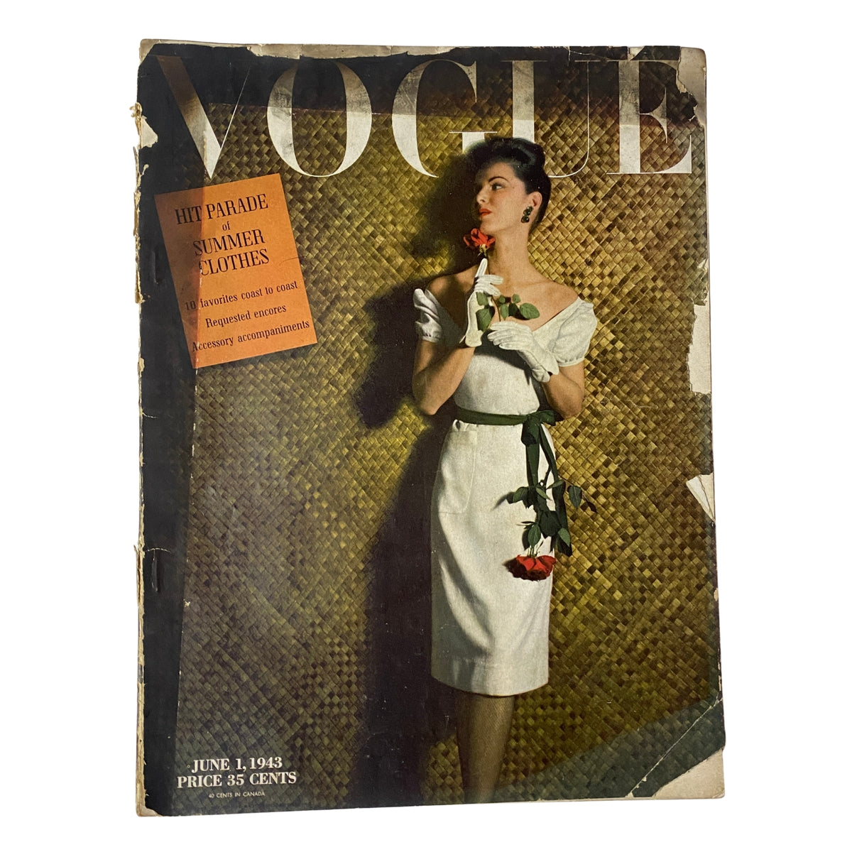 Vogue Magazine June 1, 1943 cover featuring Florence Dornin by John Rawlings, showcasing a model in a white dress with a rose against a woven background.