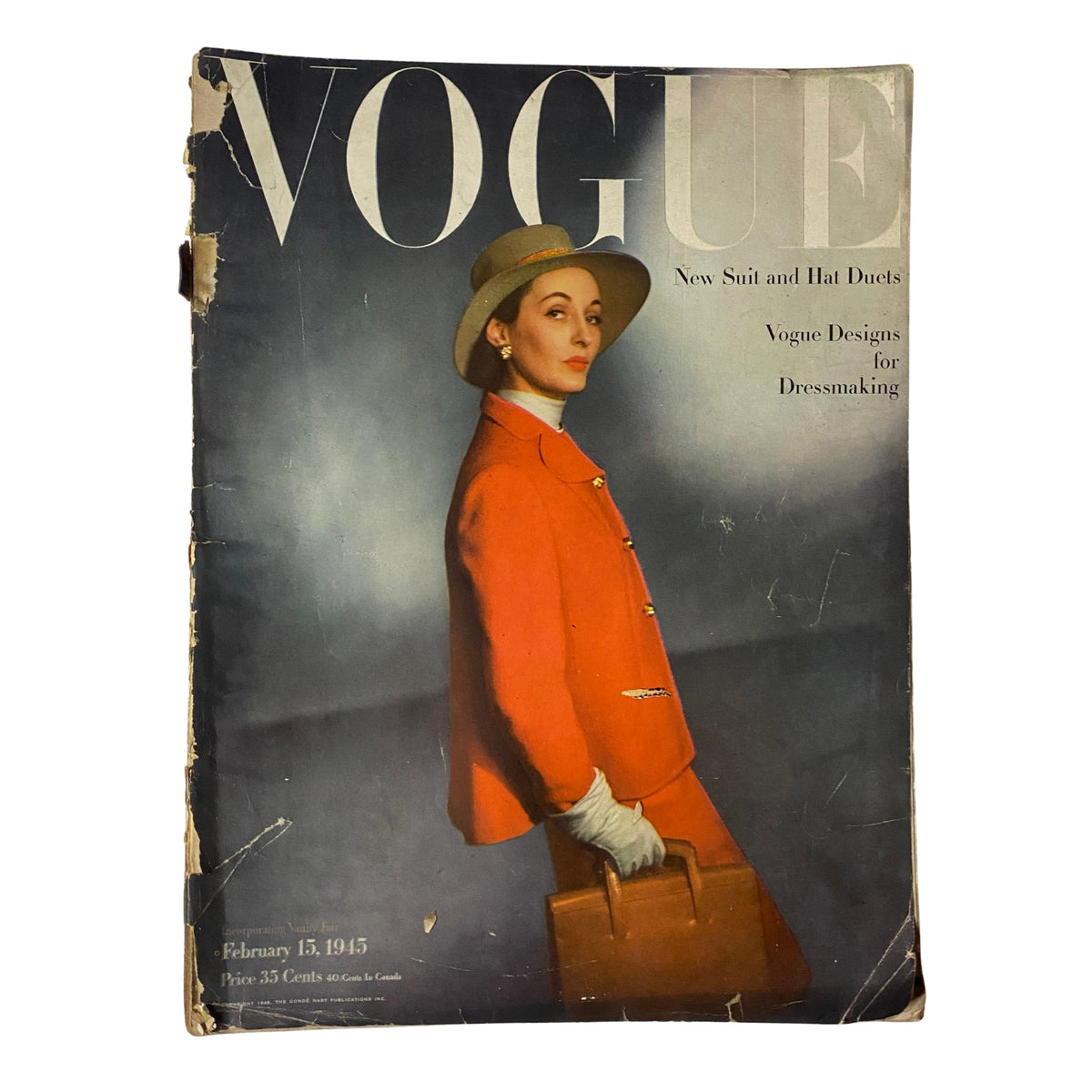 Vogue Magazine February 15, 1945 featuring a model in a red suit and hat, photographed by Horst P. Horst. The cover showcases 'Vogue Designs for Dressmaking' with a vintage aesthetic, notable wear, and historical significance.