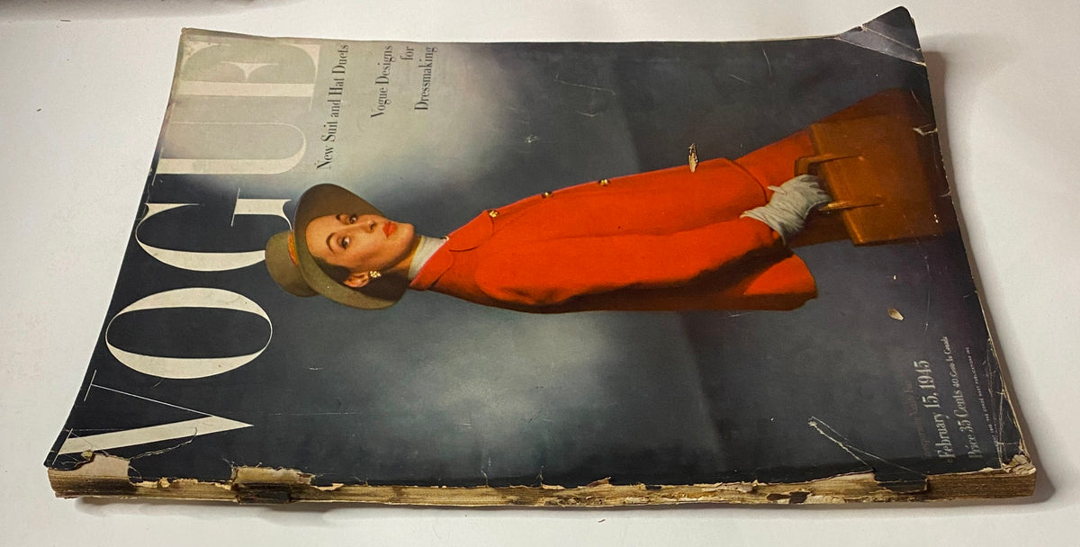 Vogue Magazine February 15, 1945 cover featuring a model in a striking red outfit, showcasing vintage fashion by Horst P. Horst. This original issue highlights mid-century design and style.