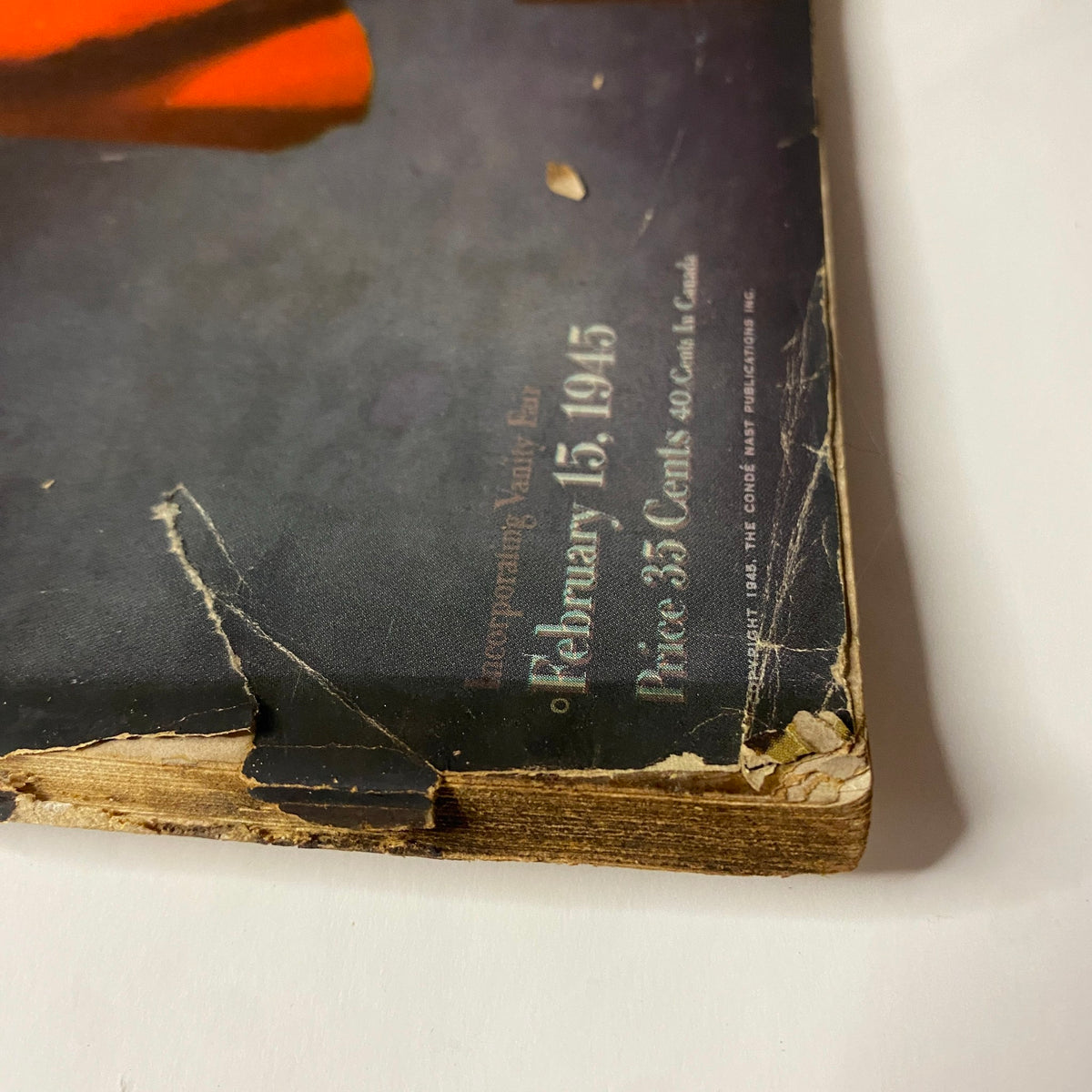Detailed image of the edge of Vogue Magazine February 15, 1945, showcasing its vintage qualities with signs of age and handling, emblematic of mid-century magazines.