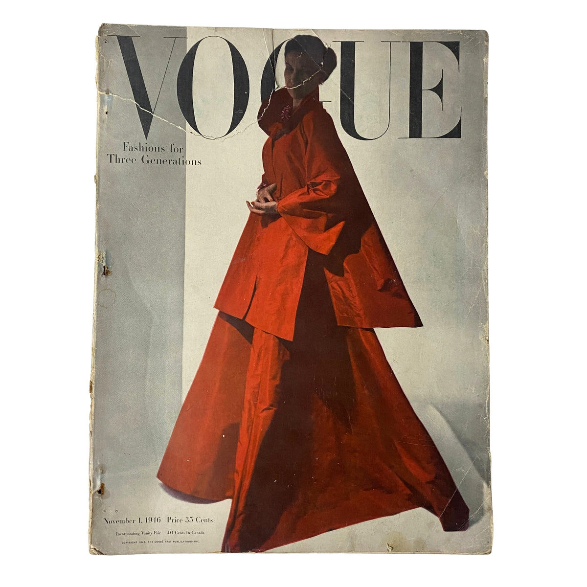 Vogue Magazine November 1, 1946 cover featuring a model in a striking red outfit, showcasing styles for three generations. The magazine reflects post-war fashion trends.