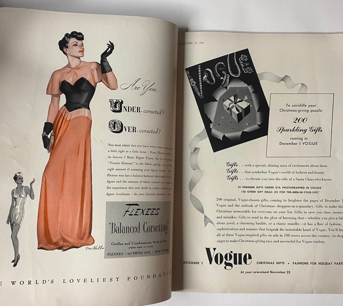 Vogue Magazine November 15, 1941 The House of Vanderbilt GD Interior showcasing a model wearing a glamorous gown with a dramatic cut and black accents, alongside an advertisement for '200 Sparkling Gifts' in Vogue.