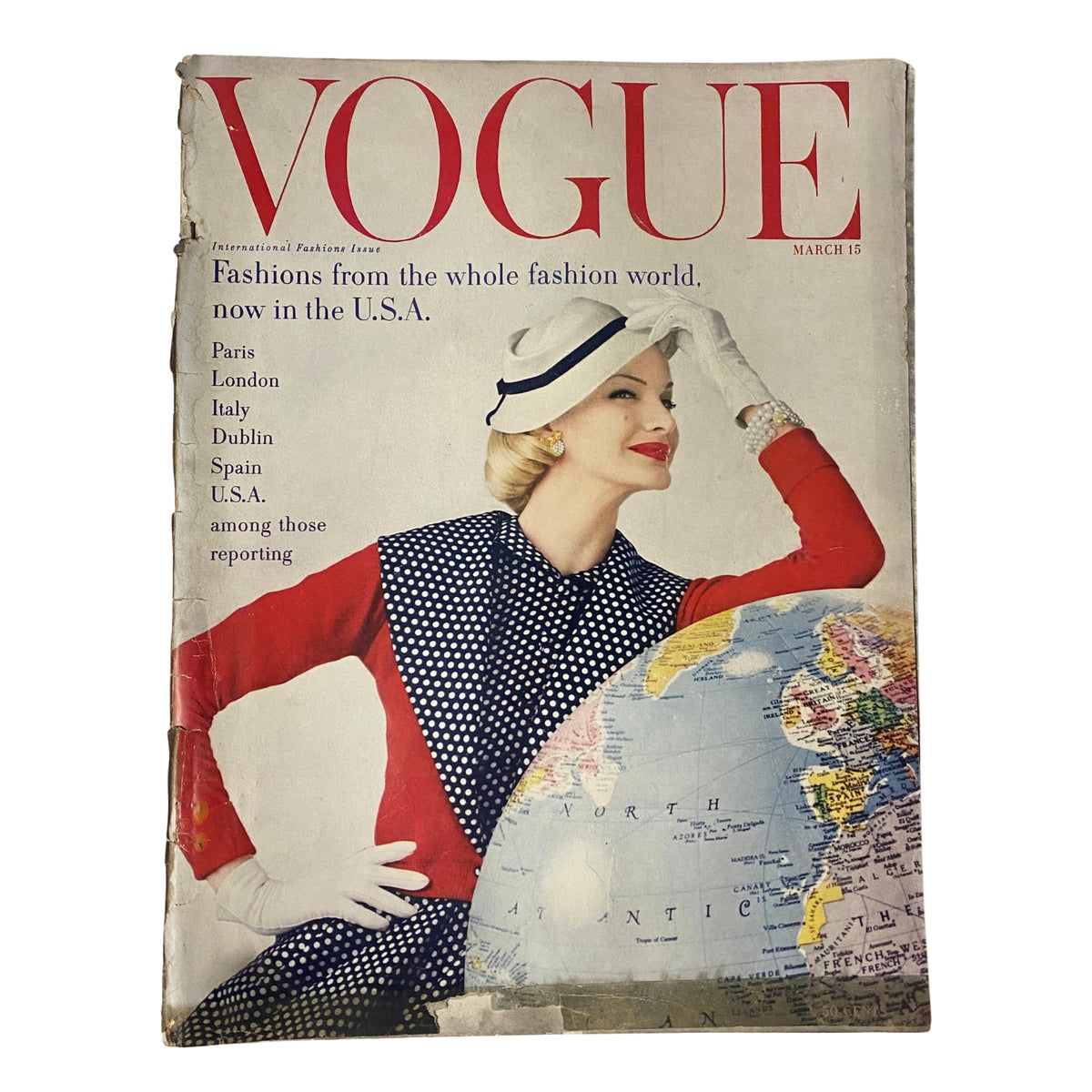 Cover of Vogue Magazine from March 15, 1955, featuring Sunny Harnett by John Rawlings, showcasing international fashions prominent in the U.S.