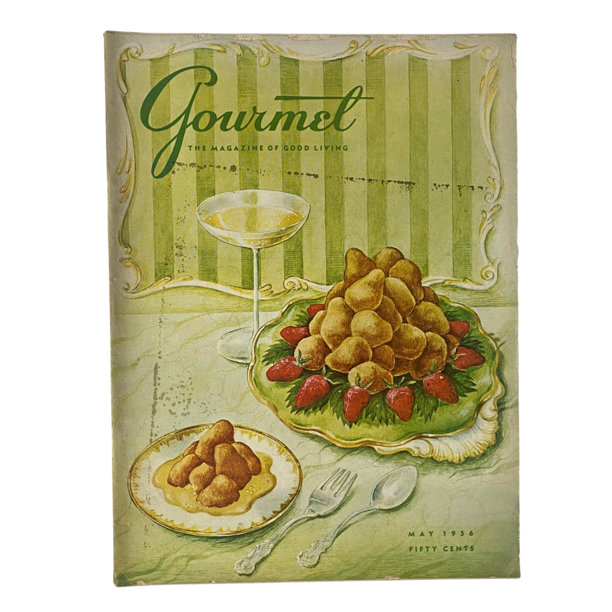 Cover of Gourmet Magazine May 1956 featuring a culinary illustration with cookies and strawberries, designed by Hilary Knight. The magazine highlights gourmet cooking and classic dining aesthetics.