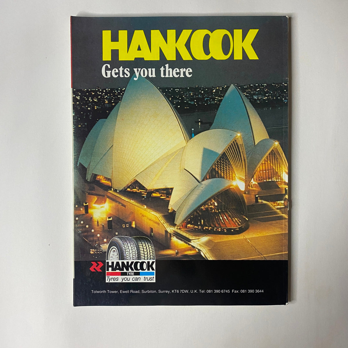 Hankook advertisement featuring the iconic Sydney Opera House, promoting reliable tyres with the tagline 'Gets you there' in the context of Car Magazine UK Import November 1990.