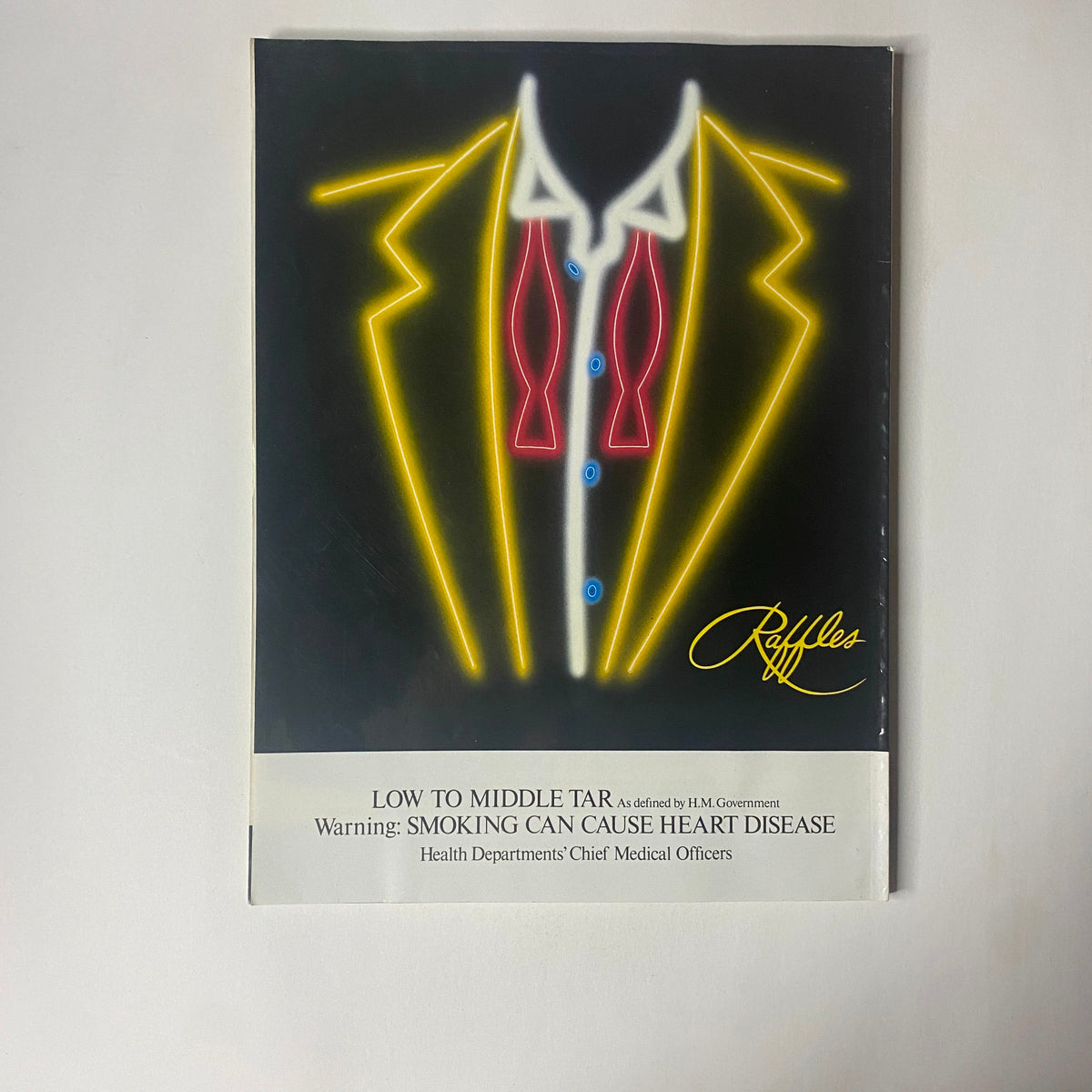 Back cover of Car Magazine UK Import June 1990 featuring a unique neon design with a tuxedo graphic and a health warning about smoking.