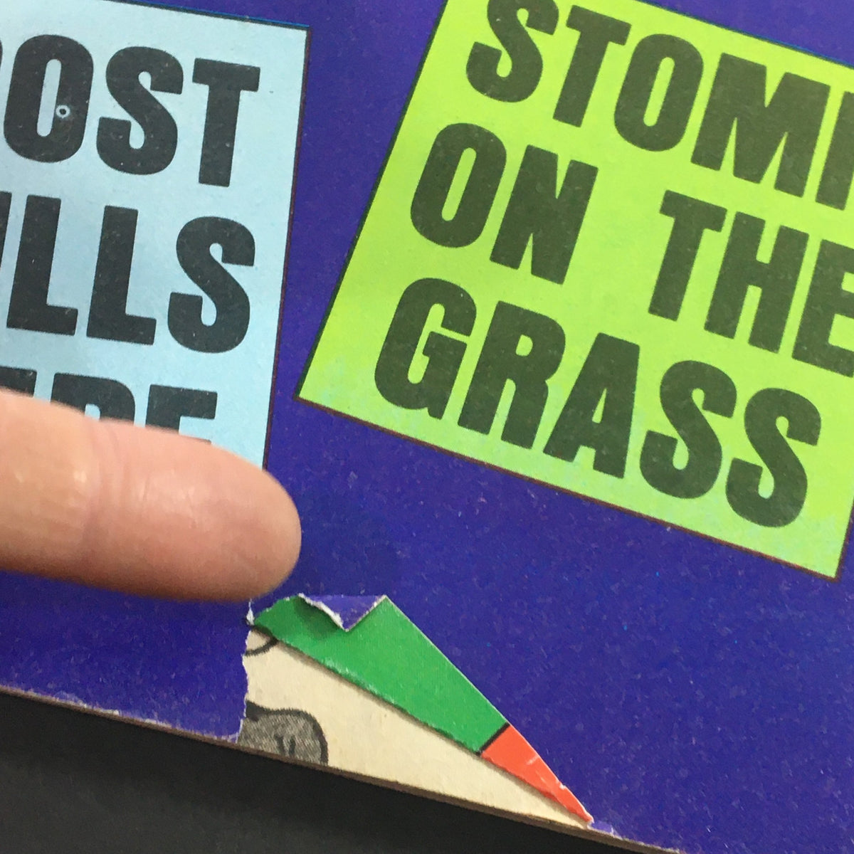 Close-up of the back cover of Wacko Magazine October 1981 Issue #3, highlighting a torn corner and humorous signage.