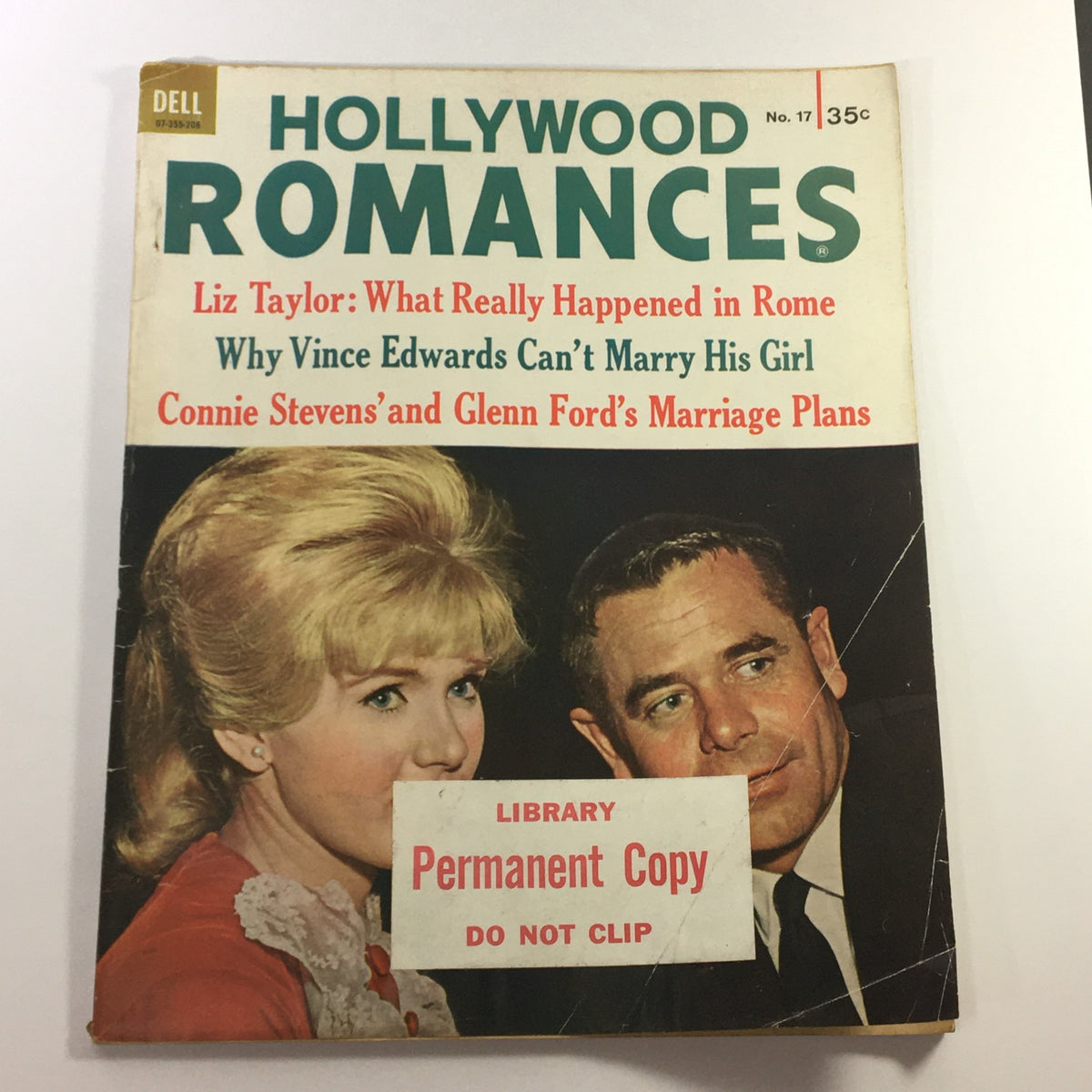 Cover of VTG Hollywood Romances Magazine 1962 No. 17 featuring Elizabeth Taylor, with articles on Hollywood romances and a library copy label.